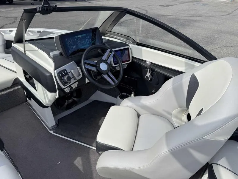 Slide: The Image of 2017 Malibu Wakesetter 20 VTX interior with modern dashboard and steering wheel. - 14