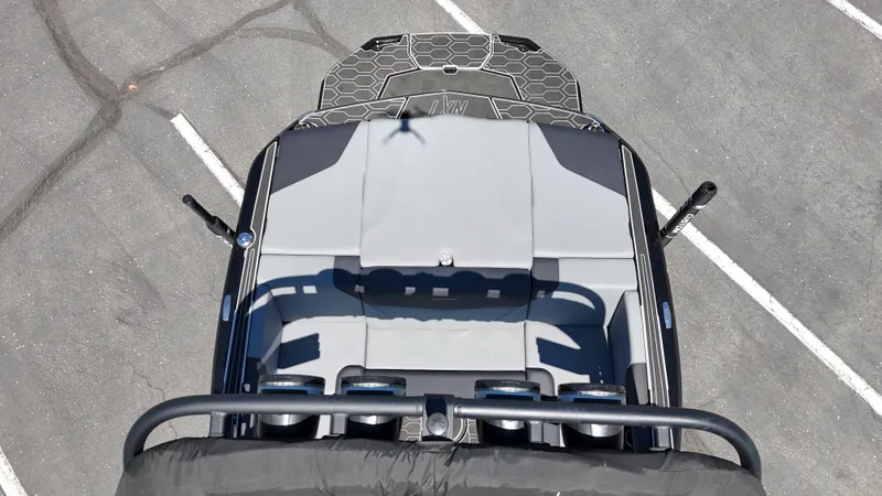 Slide: The Image of Overhead view of 2025 MasterCraft NXT22 boat on pavement. - 12