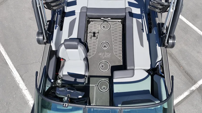 Slide: The Image of 2025 MasterCraft NXT22 boat interior with sleek seating and modern design. - 15