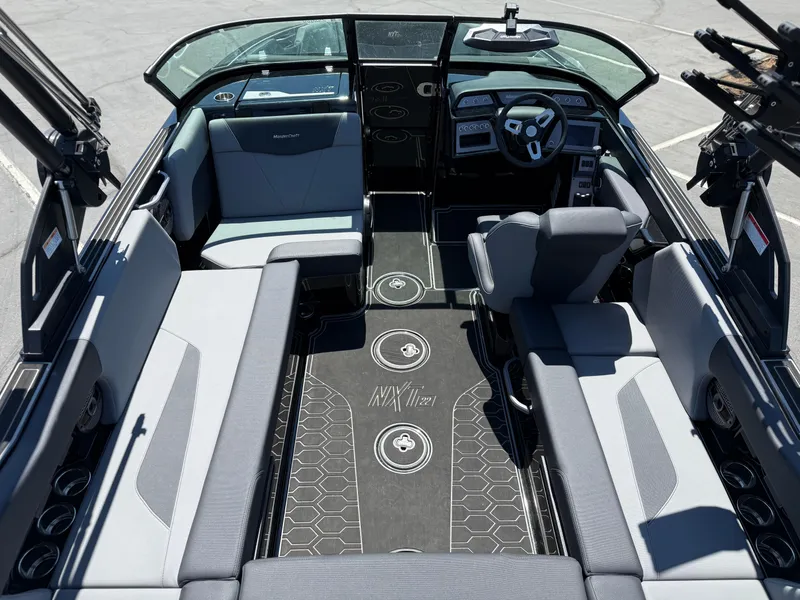 Slide: The Image of 2025 MasterCraft NXT22 boat interior with modern seating and dashboard design. - 19