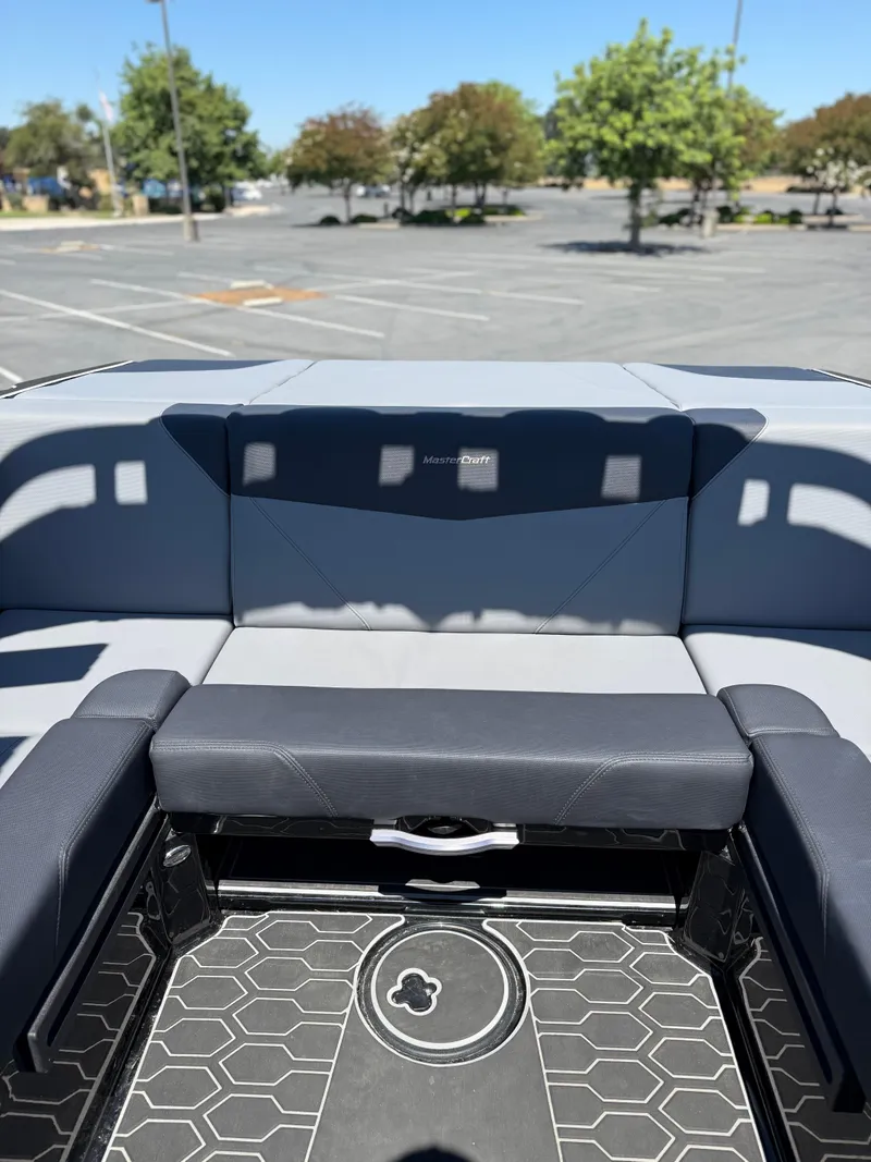 Slide: The Image of 2025 MasterCraft NXT22 boat interior with sleek seating and modern design. - 22