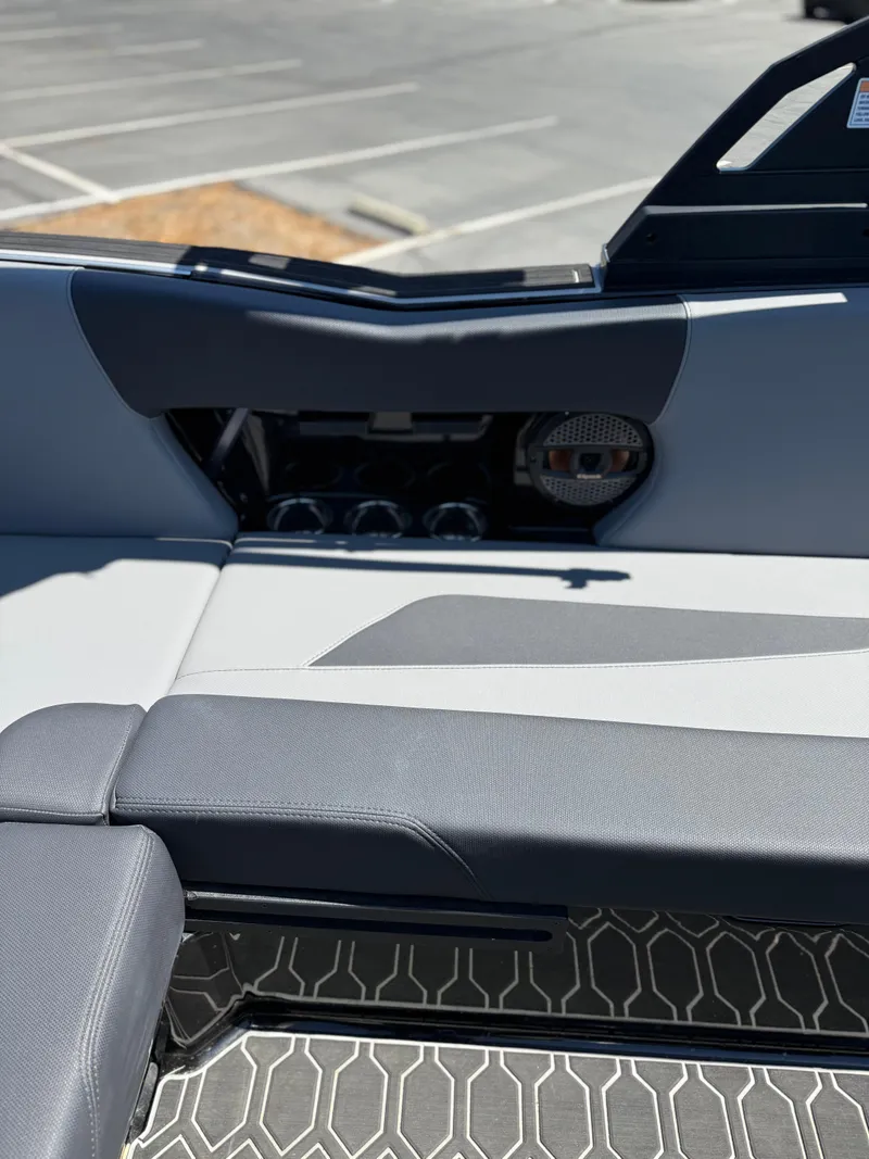 Slide: The Image of 2025 MasterCraft NXT22 interior with sleek seating and modern design elements. - 25