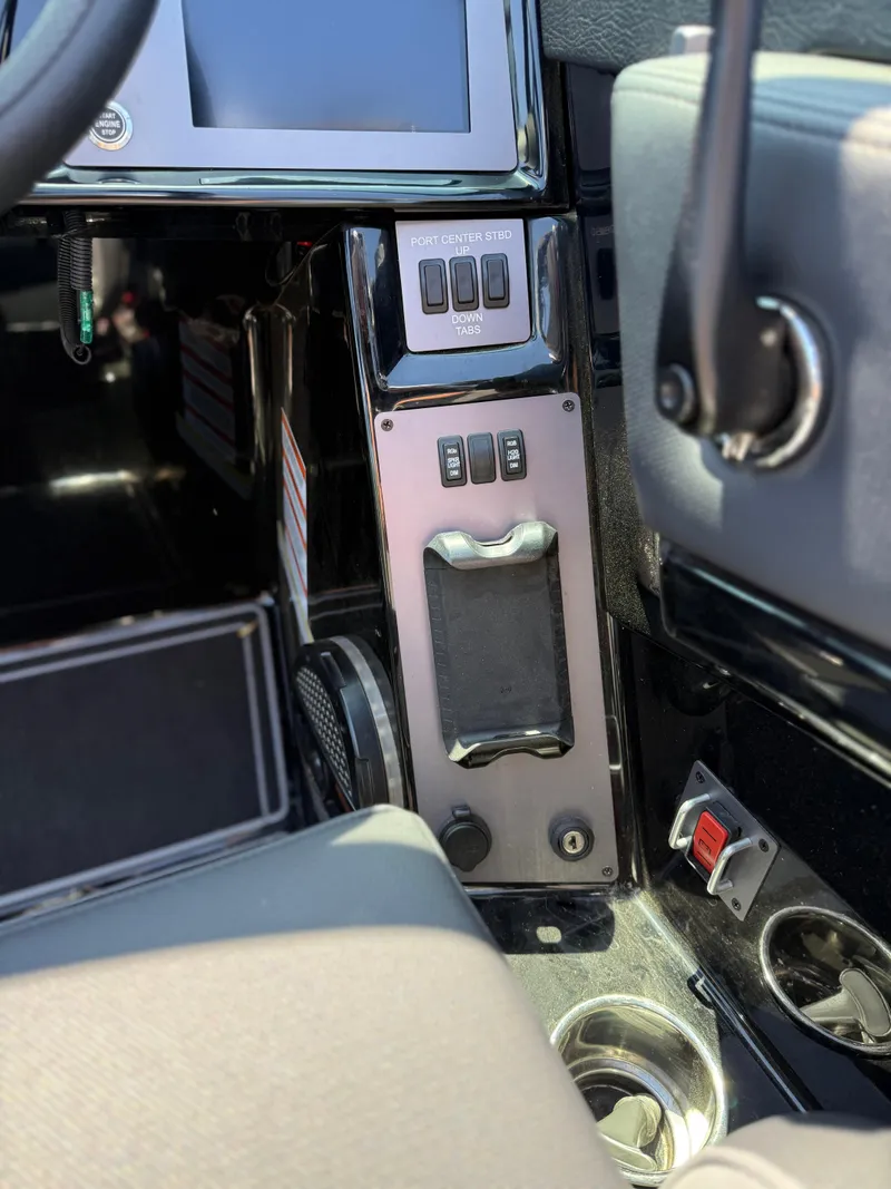 Slide: The Image of 2025 MasterCraft NXT22 boat dashboard with control panel and switches. - 30