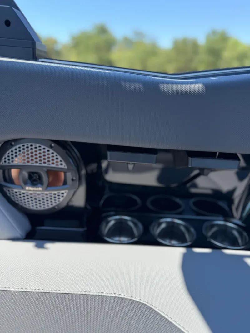 Slide: The Image of Interior of 2025 MasterCraft NXT22 boat with speaker and cup holders. - 33