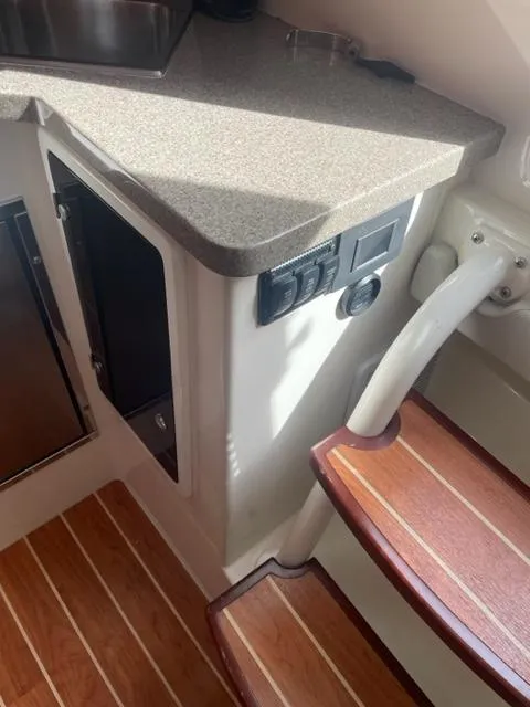 Slide: The Image of Interior of 2018 Regulator 41 boat with wooden steps and countertop. - 24