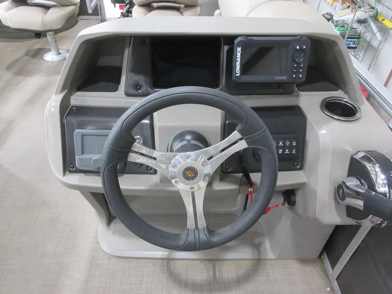Slide: The Image of 2024 Sun Tracker Fishin' Barge 20 DLX helm with steering wheel and Lowrance display. - 10