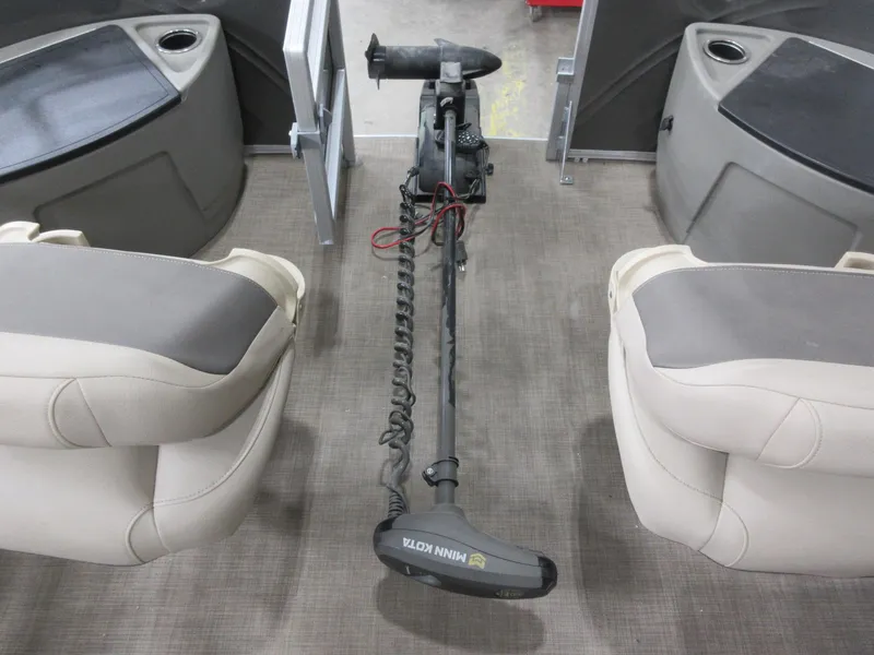 Slide: The Image of 2024 Sun Tracker Fishin' Barge 20 DLX interior with Minn Kota trolling motor. - 12
