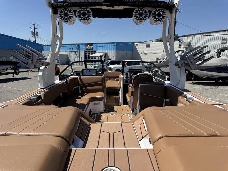 Slide: The Image of 2023 Supra SA boat interior with tan seating and modern design features. - 10