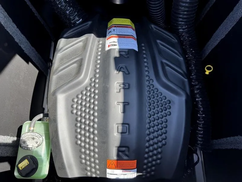 Slide: The Image of 2023 Supra SA engine cover with "Raptor" branding and visible fluid reservoir. - 15