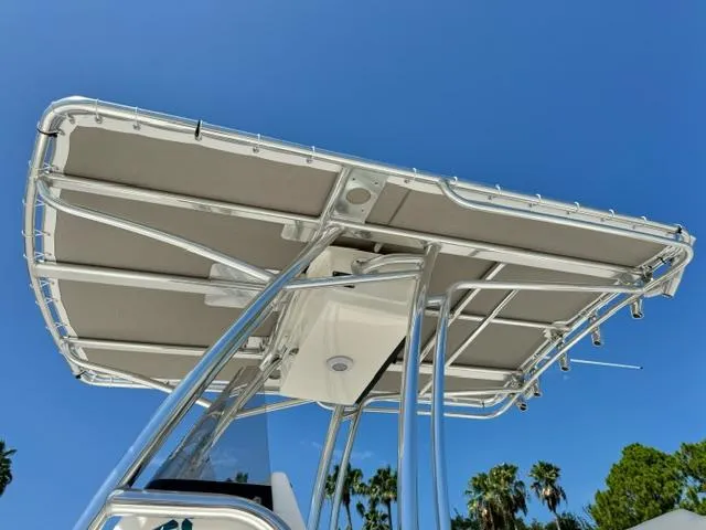 Slide: The Image of 2026 Key West 219 FS boat T-top against clear blue sky. - 9