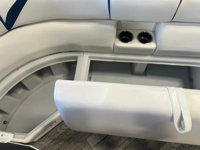 Slide: The Image of 2018 Berkshire 23 CLSTS2.75 boat interior with white seating and cup holders. - 7