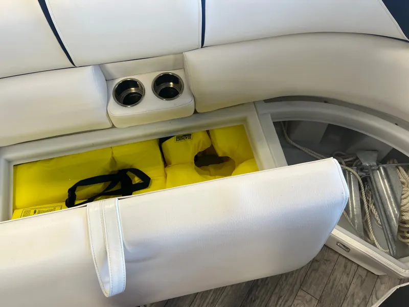 Slide: The Image of 2018 Berkshire 23 CLSTS2.75 boat seat storage with life jackets and anchor. - 8