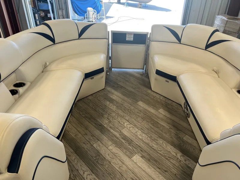 Slide: The Image of Interior of 2018 Berkshire 23 CLSTS2.75 pontoon boat with white and blue seating. - 9