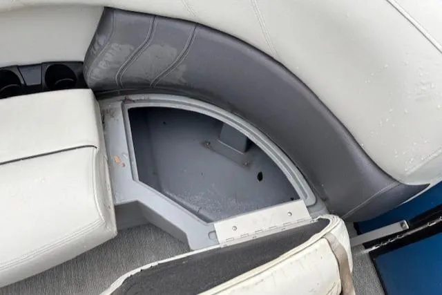 Slide: The Image of 2021 Sylvan Mirage 820 Cruise boat seat storage compartment, open and empty. - 15