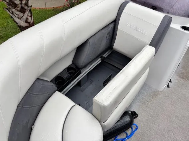 Slide: The Image of 2021 Sylvan Mirage 820 Cruise boat interior with white and gray seating. - 17