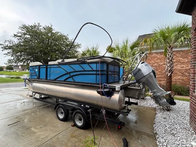 Slide: The Image of 2021 Sylvan Mirage 820 Cruise pontoon boat on trailer, parked near palm trees. - 4