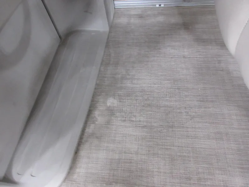 Slide: The Image of 2024 Sun Tracker SportFish 20 DLX interior flooring, featuring durable, textured surface. - 12