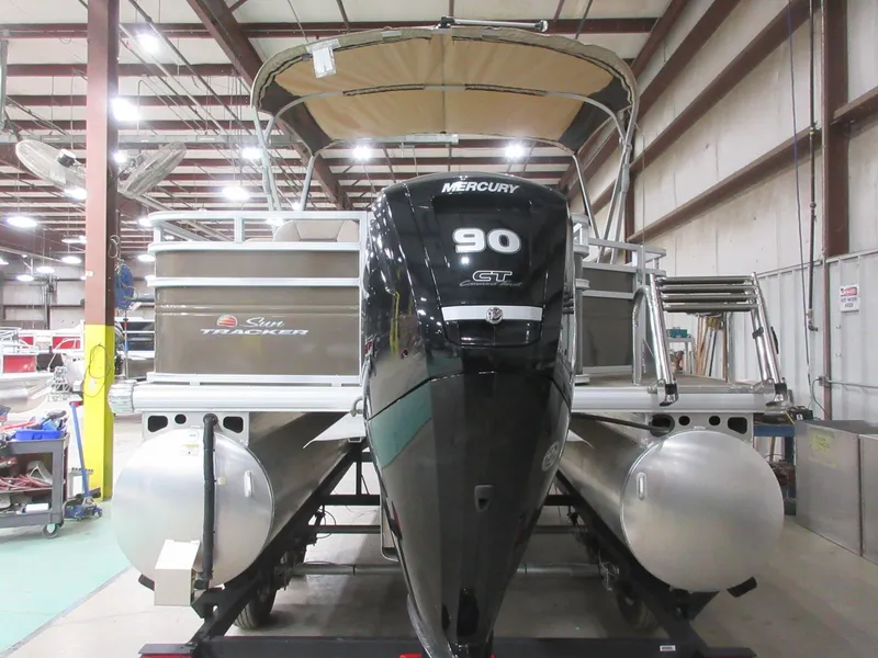 Slide: The Image of 2024 Sun Tracker SportFish 20 DLX pontoon boat with Mercury 90 engine in a warehouse. - 7