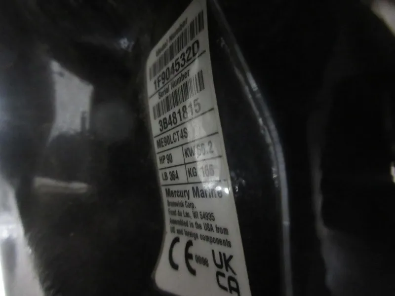 Slide: The Image of Close-up of a Mercury Marine engine label on a 2024 Sun Tracker SportFish 20 DLX. - 8