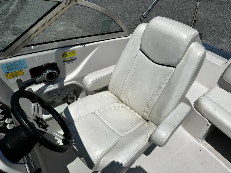 Slide: The Image of Captain's seat and steering wheel of 2002 Godfrey Hurricane SD187 boat. - 6