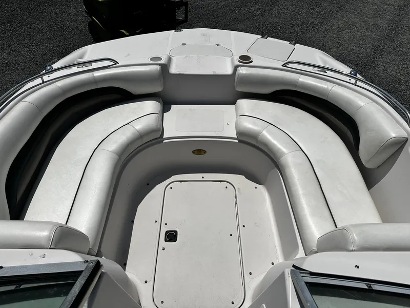 Slide: The Image of 2002 Godfrey Hurricane SD187 boat interior with white cushioned seating. - 7