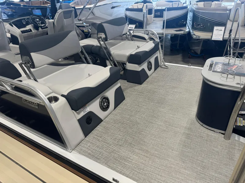 Slide: The Image of 2025 Avalon LSZ Quad Lounger Shift boat interior with plush seating and modern dashboard. - 10