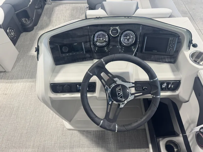 Slide: The Image of 2025 Avalon LSZ Quad Lounger Shift dashboard with steering wheel and control panel. - 4