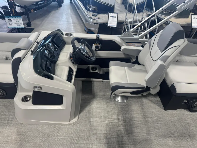 Slide: The Image of 2025 Avalon LSZ Quad Lounger Shift boat interior with modern helm and seating. - 5