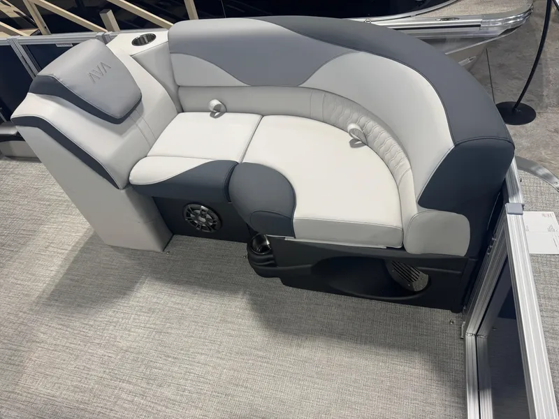 Slide: The Image of 2025 Avalon LSZ Quad Lounger Shift boat seat, gray and white upholstery, cup holder, speaker. - 6