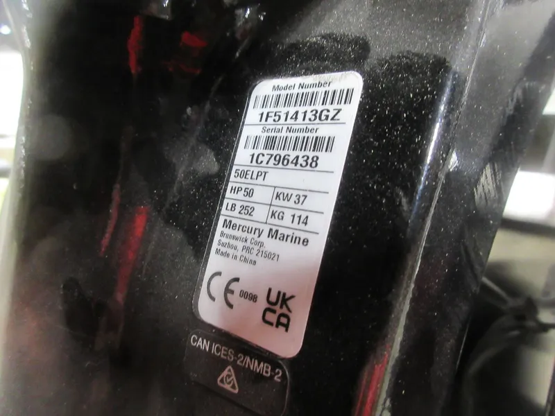 Slide: The Image of Label on Mercury Marine engine, showing model and serial numbers, horsepower, and manufacturing details. - 11