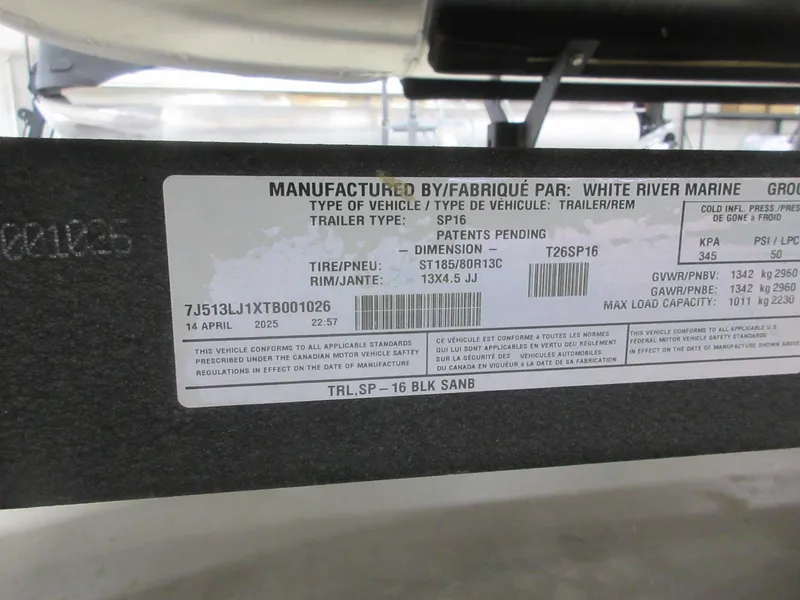 Slide: The Image of Label on Sun Tracker Party Barge 16 DLX trailer, detailing specifications and compliance information. - 12