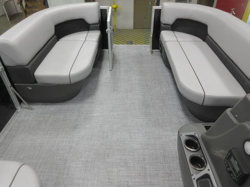 Slide: The Image of 2026 Sun Tracker Party Barge 16 DLX interior with gray seating and flooring. - 7