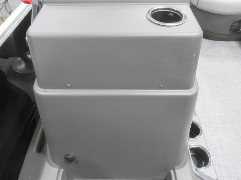 Slide: The Image of 2026 Sun Tracker Party Barge 16 DLX console with cup holders and storage compartment. - 9