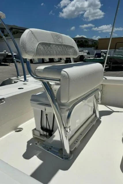 Slide: The Image of 2026 Key West 210 Bay Reef boat seat with white upholstery and chrome frame. - 11
