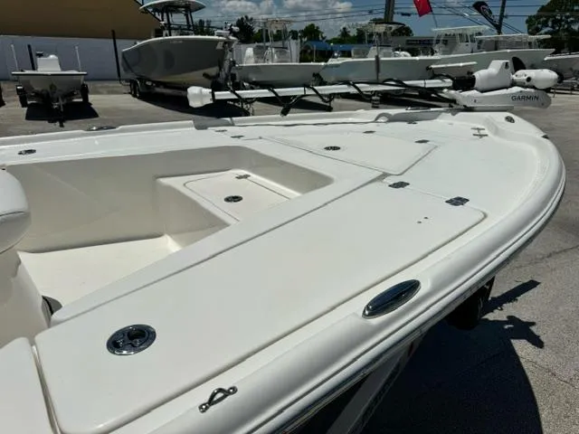 Slide: The Image of 2026 Key West 210 Bay Reef boat, white deck, docked outdoors, sunny day. - 9