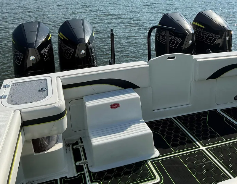 Slide: The Image of 2020 Prowler 42 boat with four powerful outboard engines on calm water. - 18