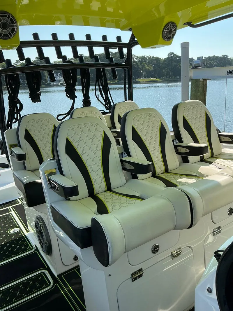 Slide: The Image of Luxurious seating on a 2020 Prowler 42 boat, featuring stylish upholstery and scenic waterfront view. - 22