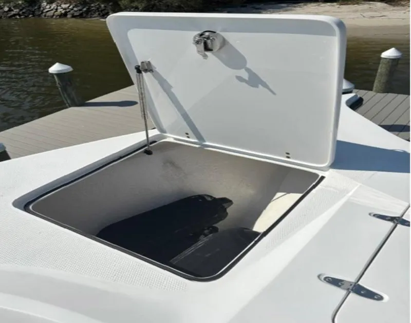 Slide: The Image of Open storage compartment on a 2020 Prowler 42 boat, dockside view. - 26