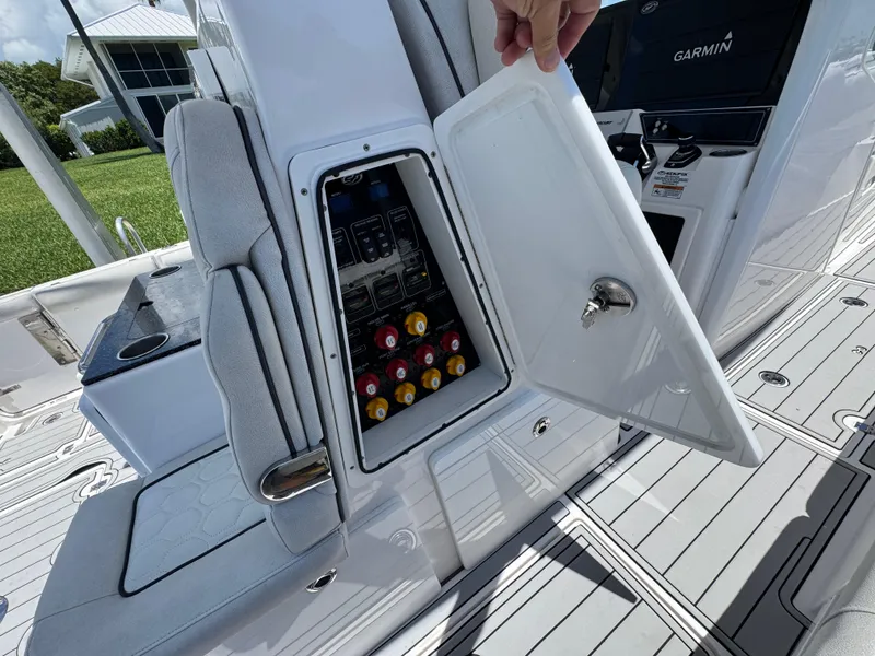 Slide: The Image of 2023 Sea Fox 368 Commander boat interior with seating, helm, and water view. - 10