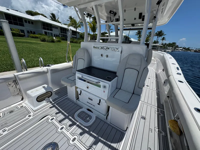 Slide: The Image of 2023 Sea Fox 368 Commander boat cockpit with Garmin navigation displays and steering wheel. - 12