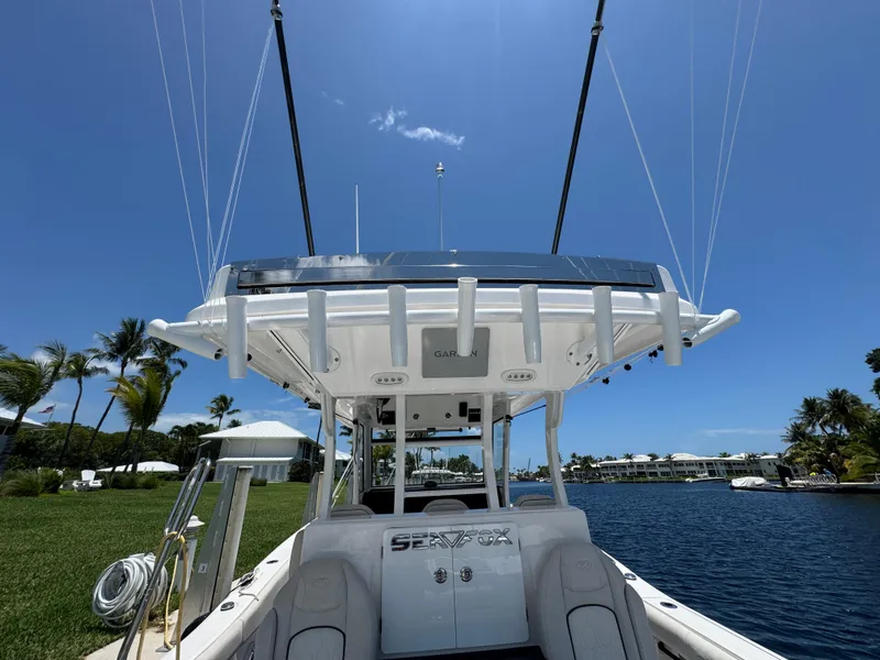 Slide: The Image of 2023 Sea Fox 368 Commander boat with open electrical panel and Garmin system. - 15