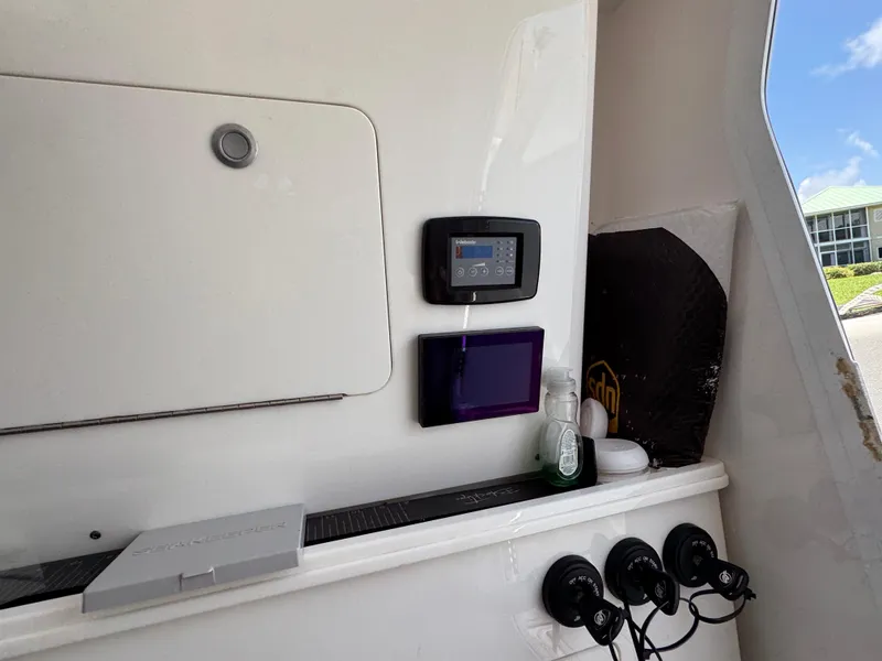 Slide: The Image of 2023 Sea Fox 368 Commander boat docked by a scenic waterfront. - 20