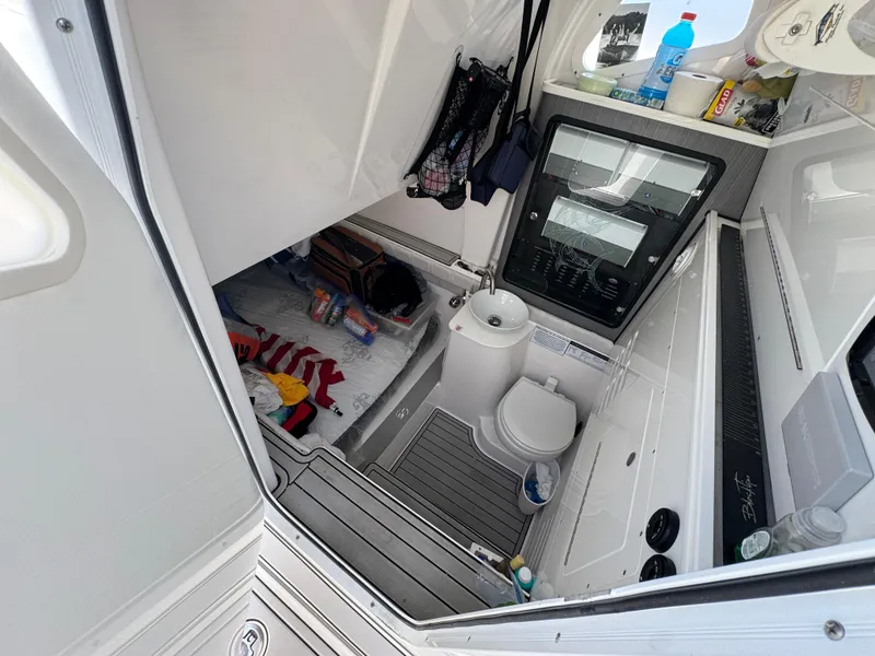 Slide: The Image of 2023 Sea Fox 368 Commander cabin interior with bed, sink, and toilet. - 29