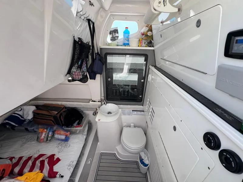 Slide: The Image of 2023 Sea Fox 368 Commander cabin interior with bed, sink, and toilet. - 30