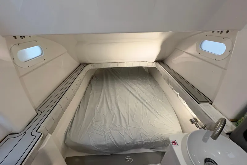 Slide: The Image of 2023 Sea Fox 368 Commander cabin interior with bed and portholes. - 33