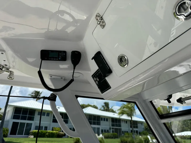 Slide: The Image of 2023 Sea Fox 368 Commander boat docked, showcasing sleek design and modern features. - 9