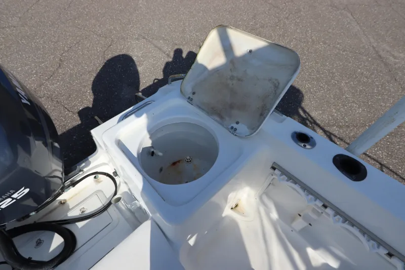 Slide: The Image of Open storage compartment on 2004 Sea Pro 220 Walk Around boat deck. - 11
