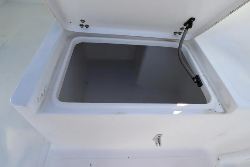 Slide: The Image of Open storage compartment on 2004 Sea Pro 220 Walk Around boat. - 13