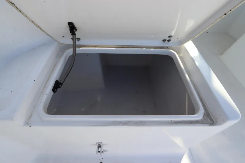 Slide: The Image of Open storage compartment on a 2004 Sea Pro 220 Walk Around boat. - 15