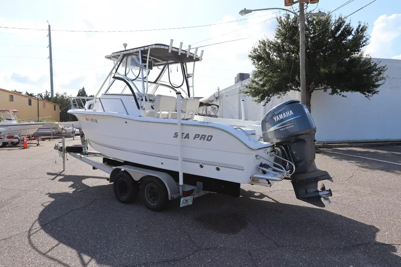 Slide: The Image of 2004 Sea Pro 220 Walk Around boat on trailer with Yamaha outboard motor. - 5